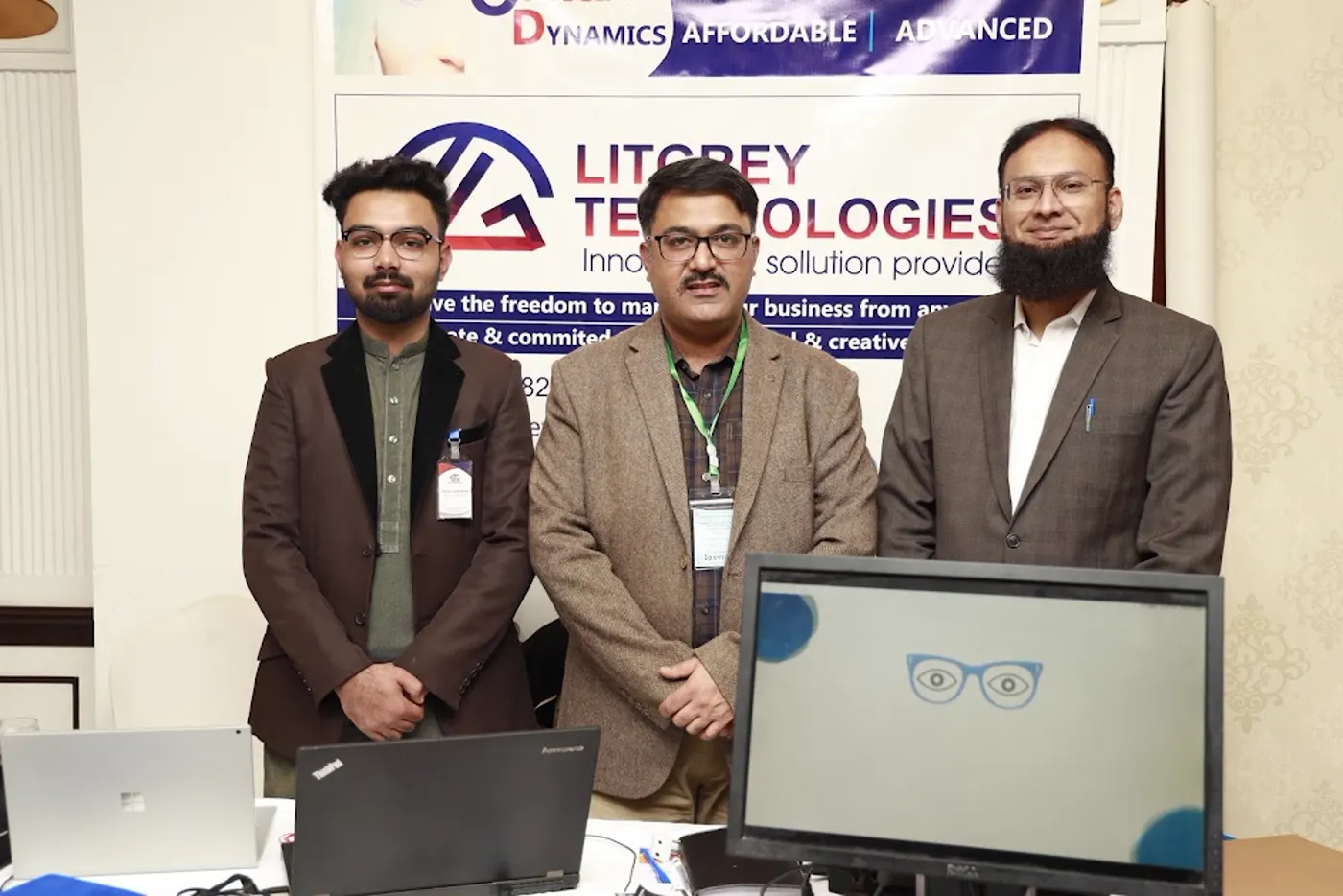 The Optician Dynamics stand with the software running on monitors under the LitGrey Technologies banner