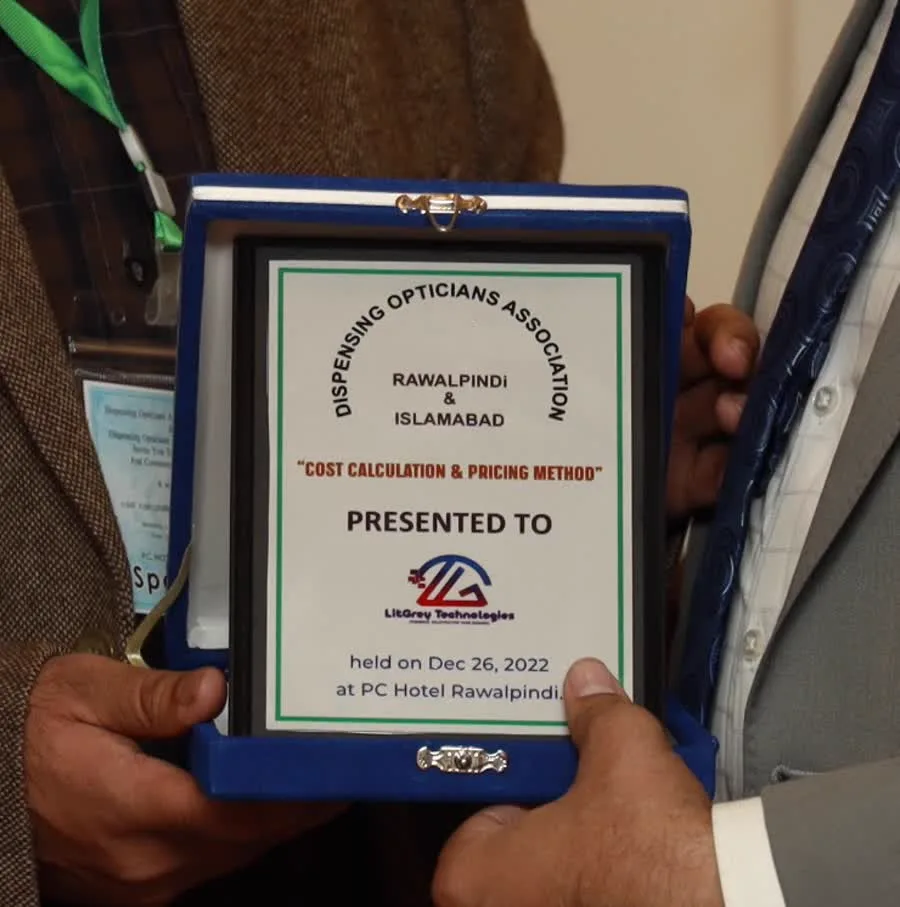 Commemorative shield reading: Dispensing Opticians Association Rawalpindi & Islamabad, Cost Calculation & Pricing Method, presented to LitGrey Technologies, held on Dec 26 2022 at PC Hotel Rawalpindi