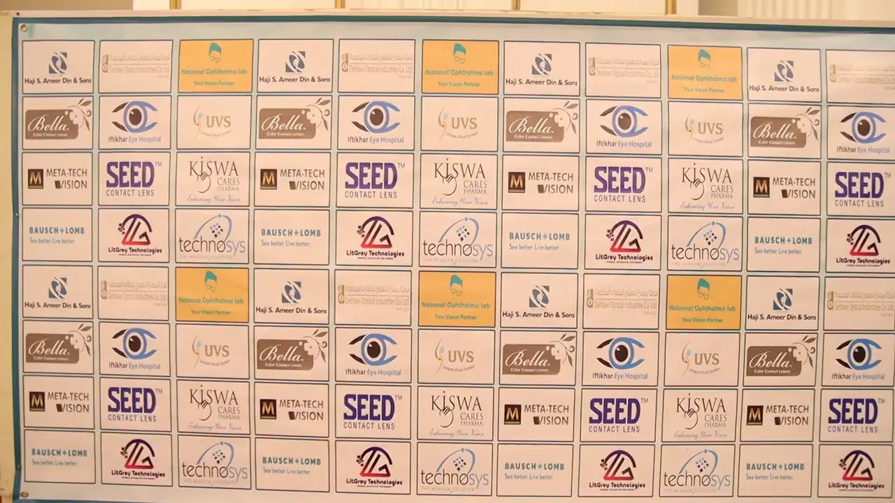 The official sponsor backdrop at the Dispensing Opticians Association workshop showing the LitGrey Technologies logo tiled alongside Bausch + Lomb, SEED Contact Lens, Kiswa, Meta-Tech Vision, Bella, UVS, Haji S. Ameer Din & Sons, National Ophthalmic Lab and Iftikhar Eye Hospital